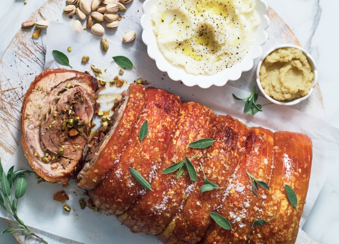 Slow-roasted crispy pork belly with spiced pistachio and apple stuffing