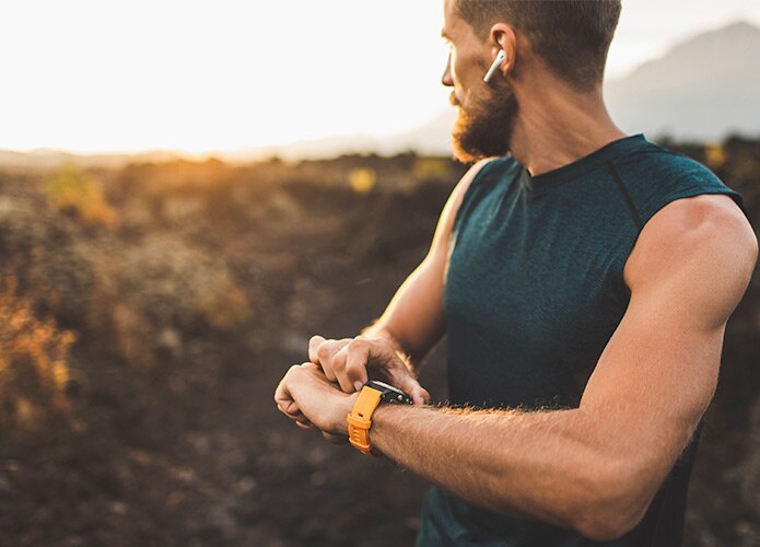 Man wearing smart watch and air pods