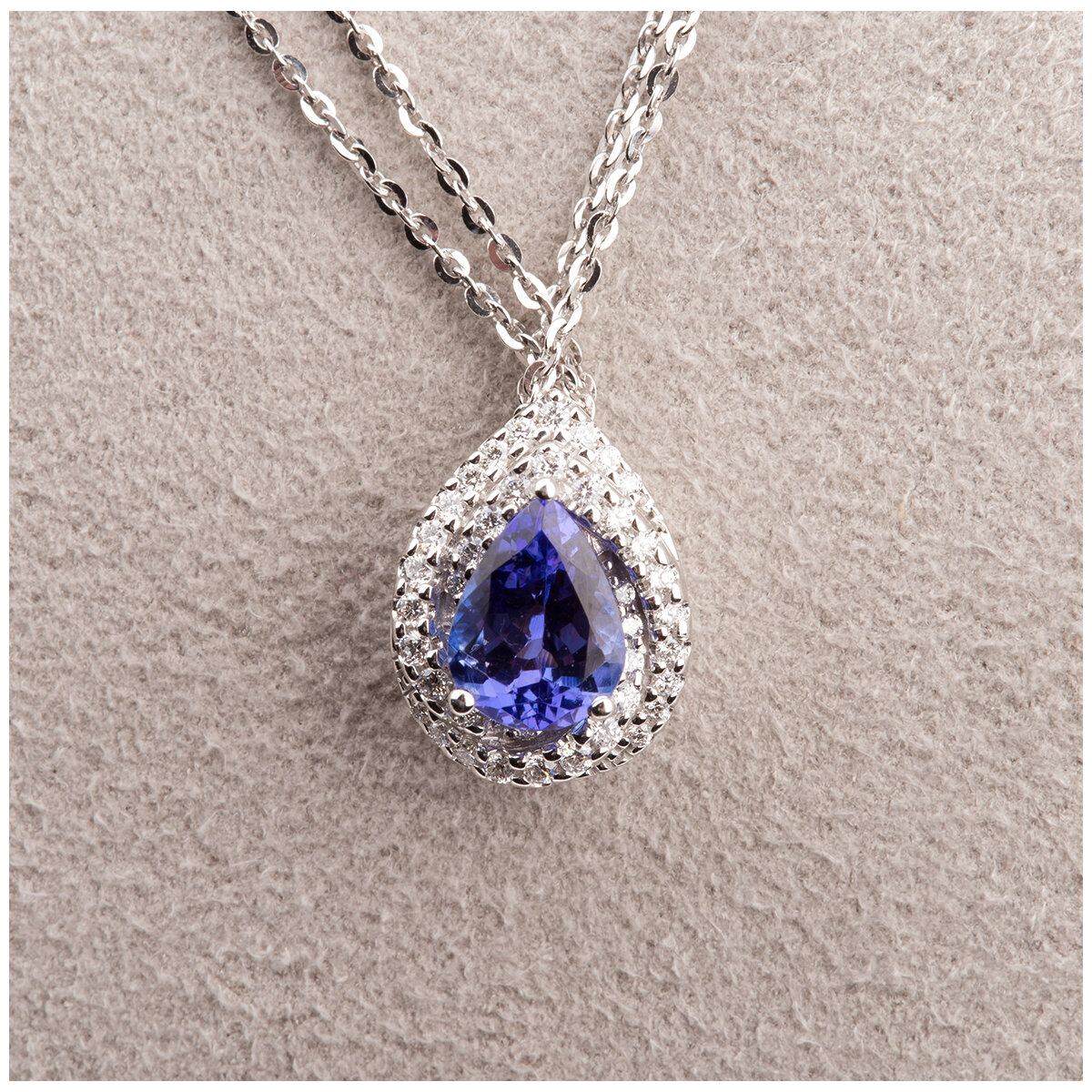 14KT White Gold 0.21ctw Diamond Tanzanite Pear Shape Pendant